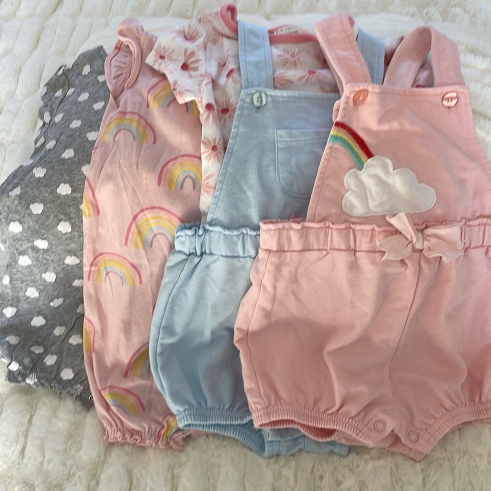 4 rompers 18M. 2 carters and 2 First Impressions (one has a shirt with it).